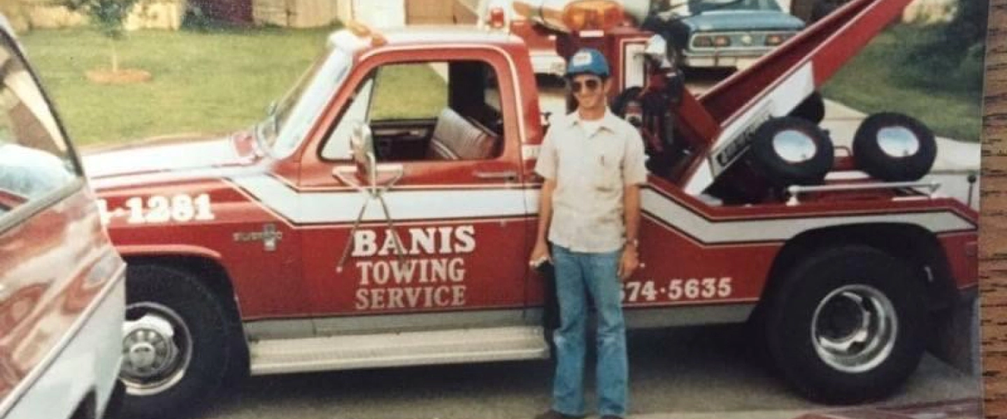 old image of tow truck and owner